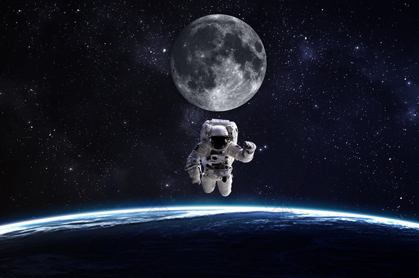 宇航员在外层空间行星地球的背景。这幅图像由美国国家航空航天局提供的<strong>元素</strong>.