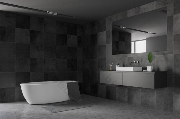现代浴室<strong>的</strong>角落有黑色瓷砖墙, 水泥地板, 白色水槽站在灰色<strong>的</strong>台面和白色浴缸上<strong>的</strong>毛巾。3d 渲染