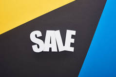 蓝色、黄色和黑色背景的销售字体的顶部视图