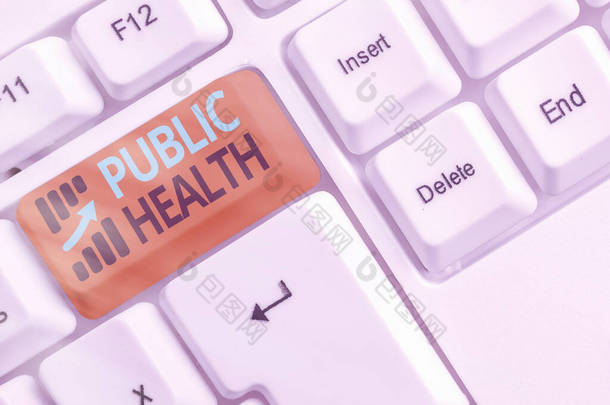 手写文本《公共卫生》。在白键复制空间之上空白键键盘保护和改善社区健康的科学概念.