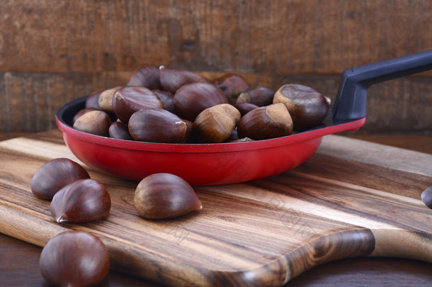 Chestnuts on Rustic Wood Table