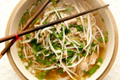 Vietnamese pho soup, an ethnic meal of chicken soup
