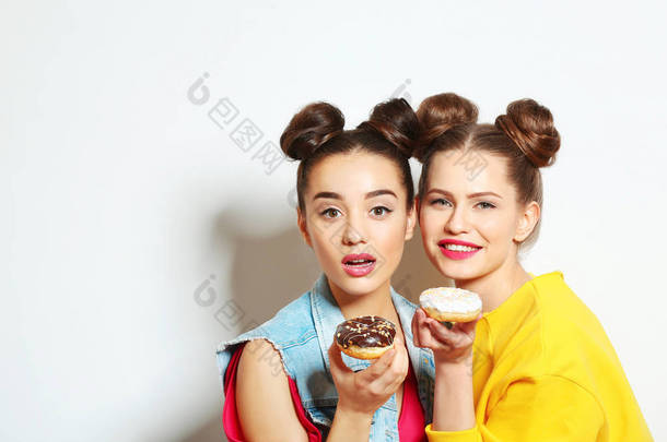 women with tasty donuts