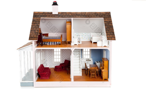 孩子的玩具娃娃房子与白色的家具