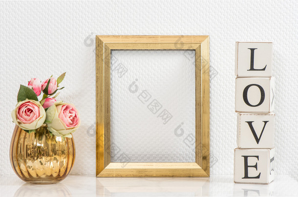 Mock up with golden frame and flowers. Love concept