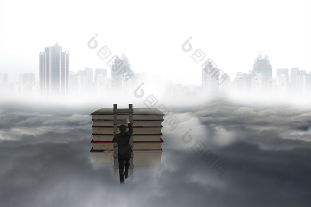 Business man climbing on wooden ladder to top of books