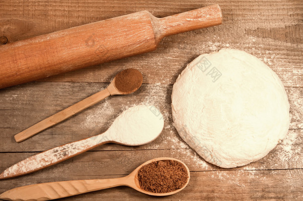 homemade baking. Fresh dough for pastry, kitchen rolling pin, spoon flour on a chopping Board