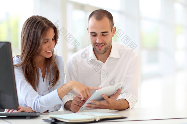 Young adults  using touchpad