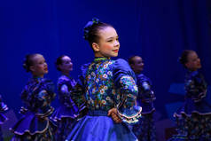 Girl dancing modern dance. She is portrayed restless soul hiding her face in anguish.  