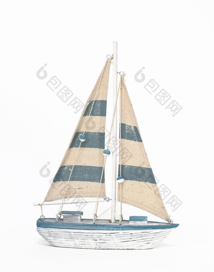 Wooden toy sailing boat on white background