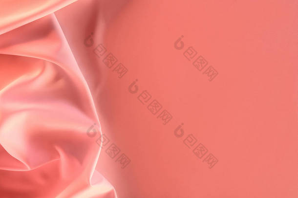 以优雅的粉红色丝绸面料为背景的特写