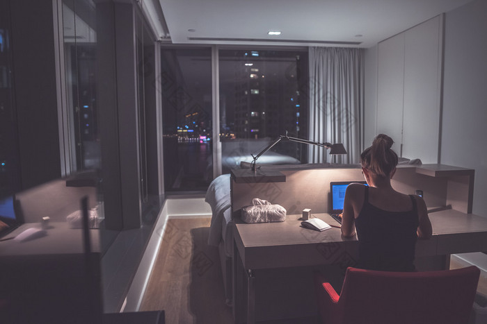 Young woman overworking in the office