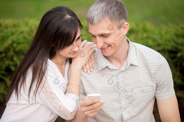 Couple playing with phone