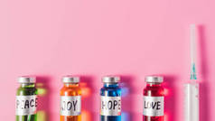 顶端的注射器和瓶子的爱, 希望, 喜悦和和平疫苗标志在粉红色的表面上行
