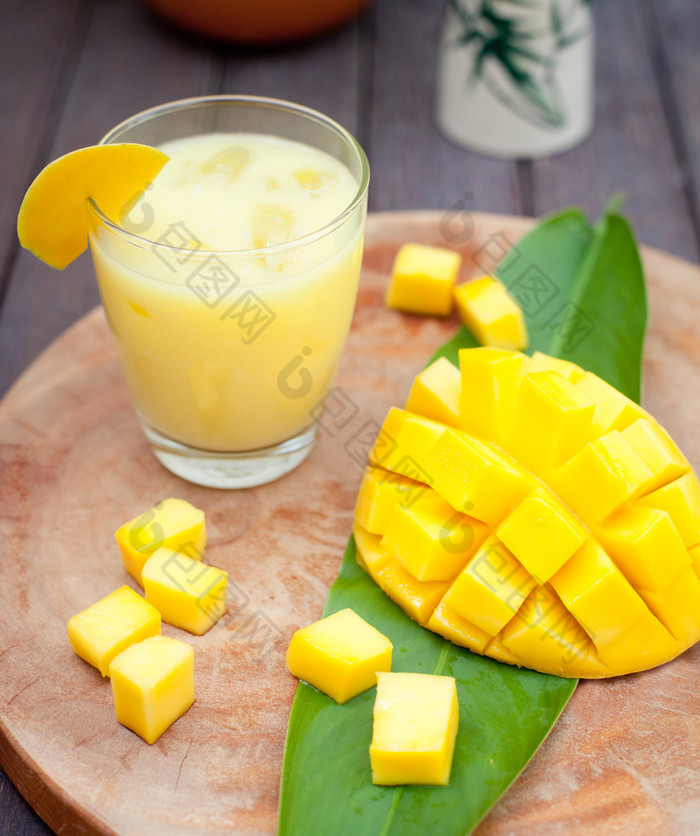 Mango juice, smoothie ,mango fruit on a wooden background