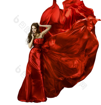 女人美容时尚服饰、 优雅的红色丝绸长袍挥舞着织物，飘飘龙布在风力发电、 孤立在白色的背景模型中的女孩图片