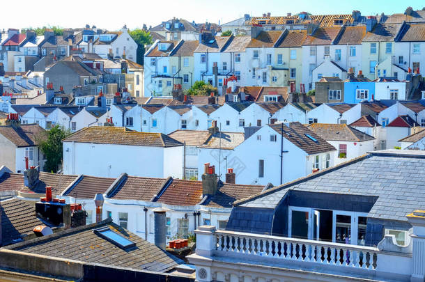 rows of English terraced houses close together on top of each ot