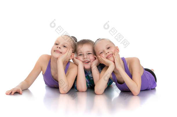 Beautiful girls gymnasts next to his <strong>young</strong>er brother