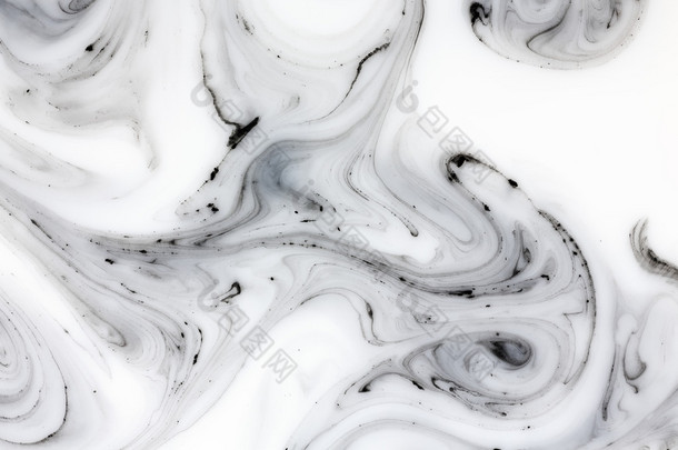 Mix of a white and black paint, closeup. 