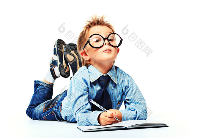 boy in spectacles and suit lying on a floor