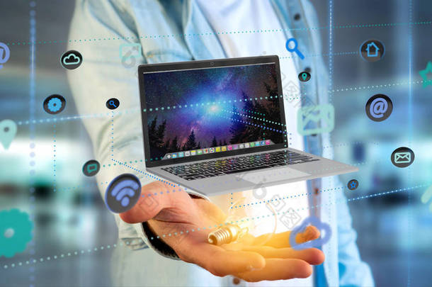 一个商人持有一台电脑周围的应用程序和社会图标的看法-3d 渲染 