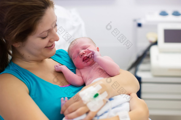 Young mother giving birth to a baby