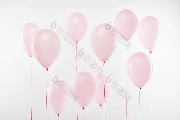 背景装饰粉红色的气球隔离在白色