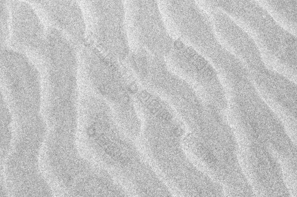 在海滩上的沙子的抽象背景涟漪