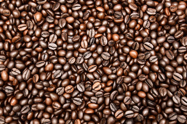 烤<strong>咖啡豆</strong>的特写照片。烤<strong>咖啡豆</strong>质地，背景和壁纸.