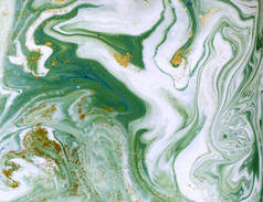 镶嵌绿色和金色的抽象背景.液态大理石图案.