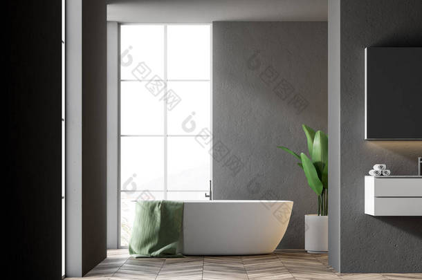 白色浴缸与绿色毛巾挂在它站在一个现代化的浴室内饰与黑色的墙壁。右边的水槽。3d 渲染模拟
