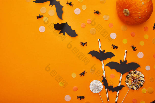 南瓜、蝙蝠和蜘蛛的头像，背景为橙色，万圣节装饰