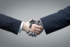 商业人与机器人手握手