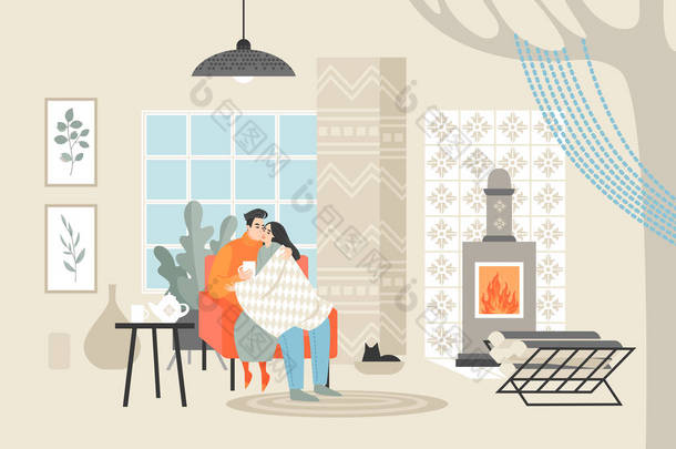 年轻的幸福夫妇坐在椅子上喝茶。男人和女人在舒适的房间里在壁炉旁享受夜晚. 