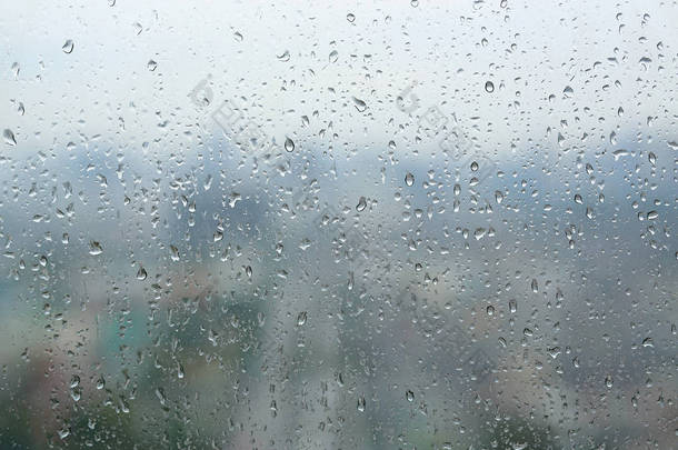 抽象的<strong>背景</strong>下，在<strong>窗户</strong>玻璃上的水滴<strong>下雨</strong>天