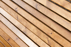 纹理背景。木制品、 木制板条。一棵树的篱笆。木制面板