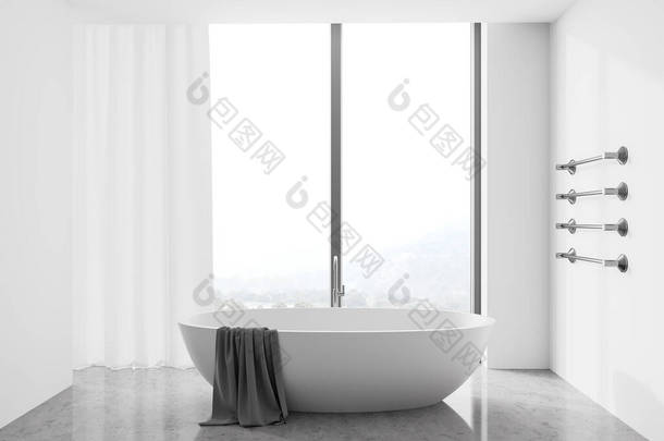 现代浴室的内部，白色的墙壁，混凝土地面，舒适的浴缸与毛巾挂在它和全景窗与模糊的山景。3d渲染