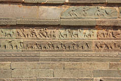 亨比寺墙上的石头浮雕。石刻古背景。雕刻的石头制成的数字。联合国教科文组织世界遗产遗址。卡纳卡, 印度。皇家围栏.