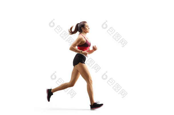 参加运动服慢跑的年轻女运动员