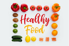 框的顶部视图与蔬菜水果和文本健康食品分离白色