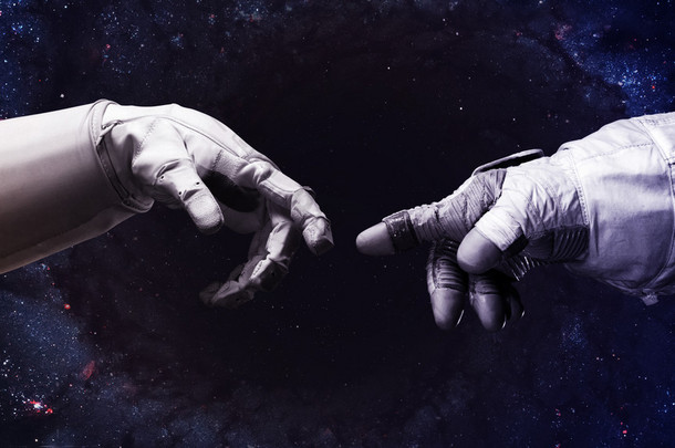 米开朗基罗神的触摸。人类的手在太空中与手指接触的近距离接触。美国航天局提供的这一图像的要素