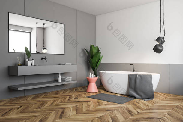 时尚浴室的角落, 有白色和灰色的墙壁, 木地板, 白色浴缸, 旁边有粉红色的椅子, 灰色水槽与水平的镜子。3d 渲染