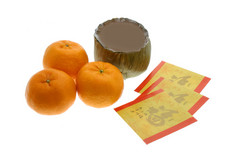 中国新的一年年糕、 橘子和红封包
