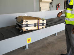 Livingstone, Zambia-August 5, 2016: A completely broken suitcase due to poor handling at a airport