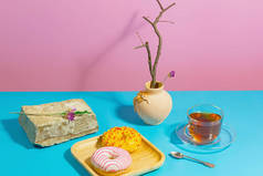 Tea with dessert on a bright colored background