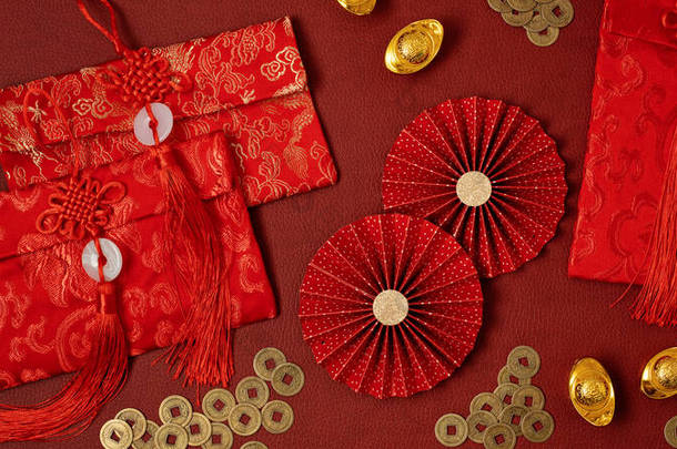 Chinese new year festival decoration over red background. Traditional lunar new year red pockets, pa