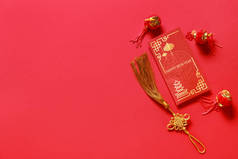 Red envelope with Chinese symbols on color background. New Year celebration