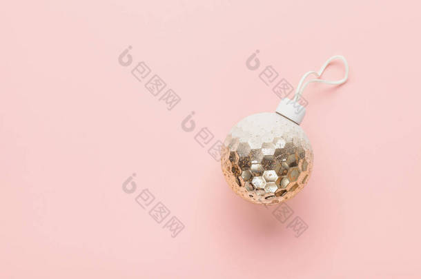 Christmas balls and lightbox with the text Happy New Year on a pink background. Flat lay