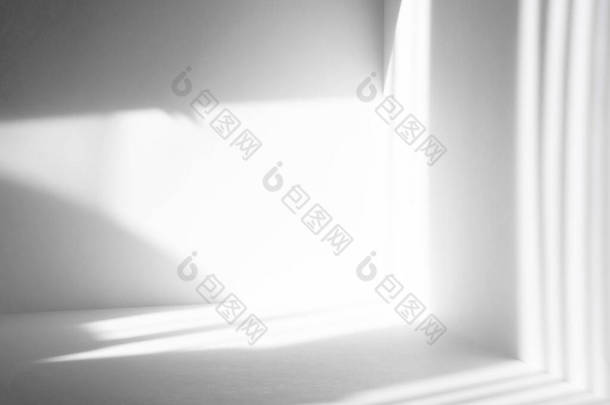 Gray shadows of different stripes on a white wall from sunlight. Abstract neutral background. Mock-u