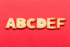 ABCDE biscuit over the red background